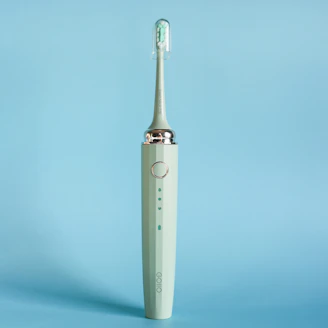 Close-up shot of the Veede Store's signature electric toothbrush highlighting its modern design.