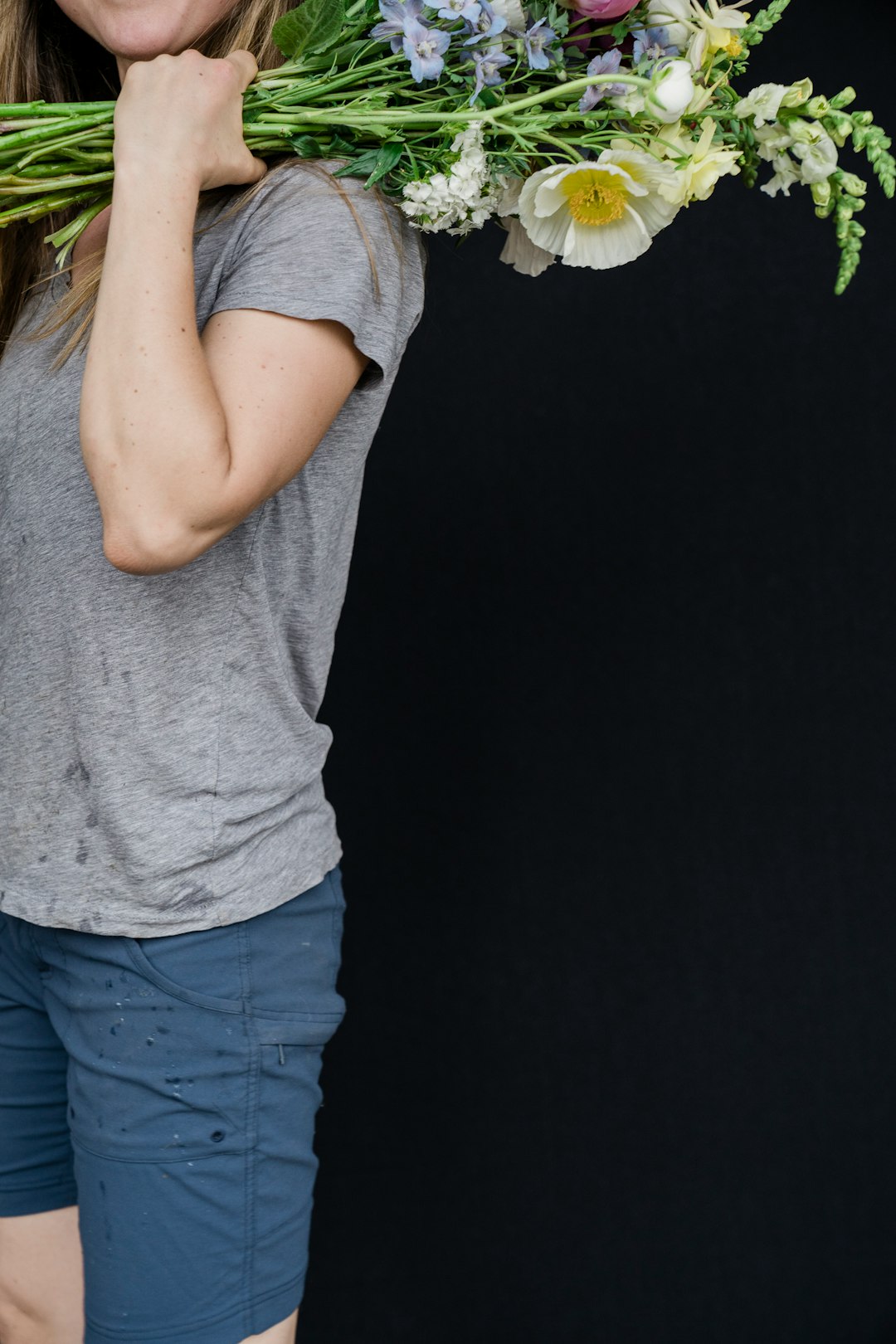 woman in gray t-shirt and blue denim jeans