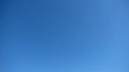 A clear blue sky with a subtle gradient