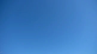 A clear blue sky with a subtle gradient