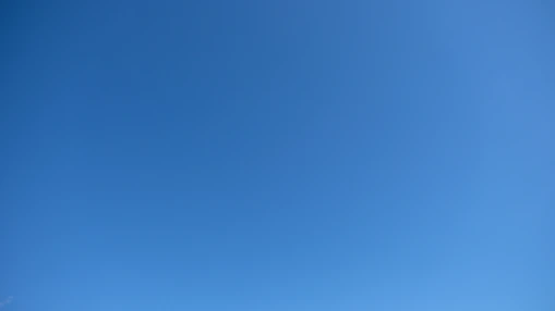 A clear blue sky with a subtle gradient