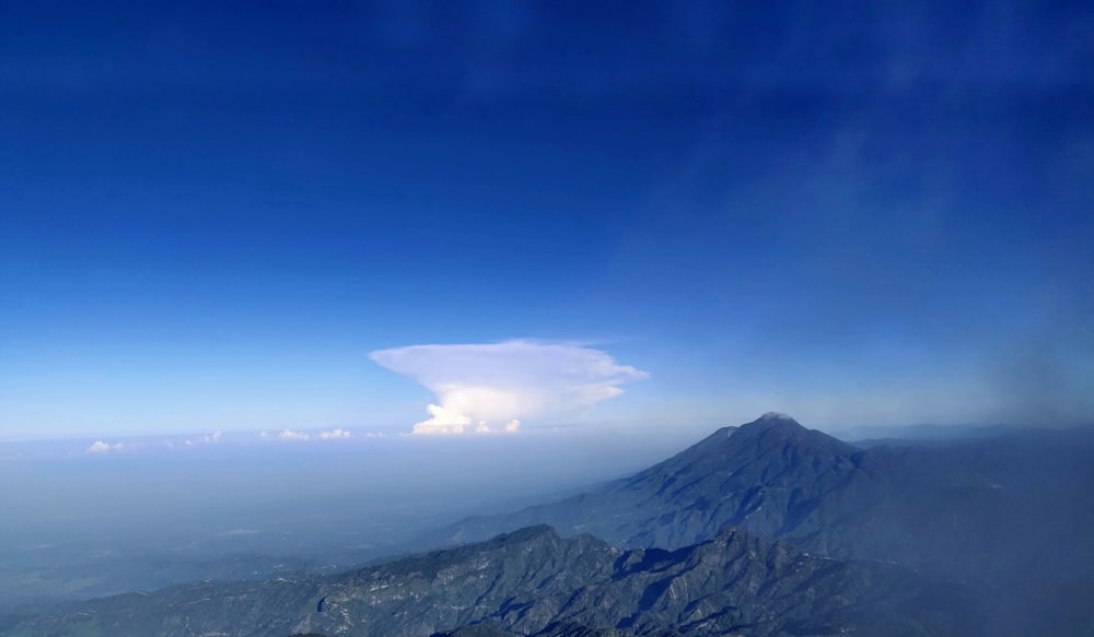 gray mountain under blue sky during daytime