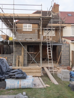 brown wooden ladder beside brown wooden wall