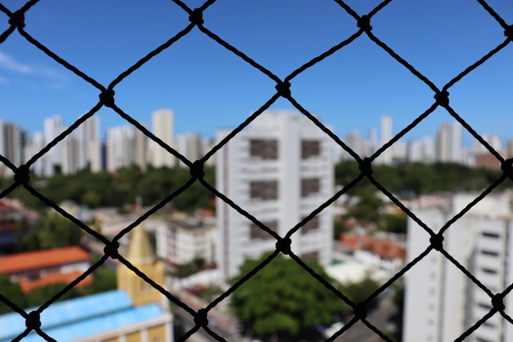 black metal fence near building during daytime