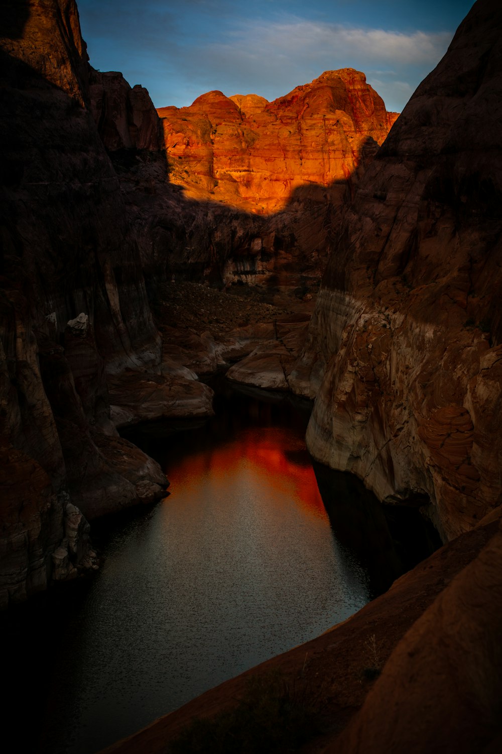 brown rock formation near body of water during daytime