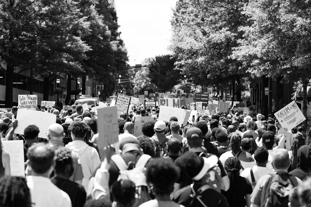 grayscale photo of people walking on street