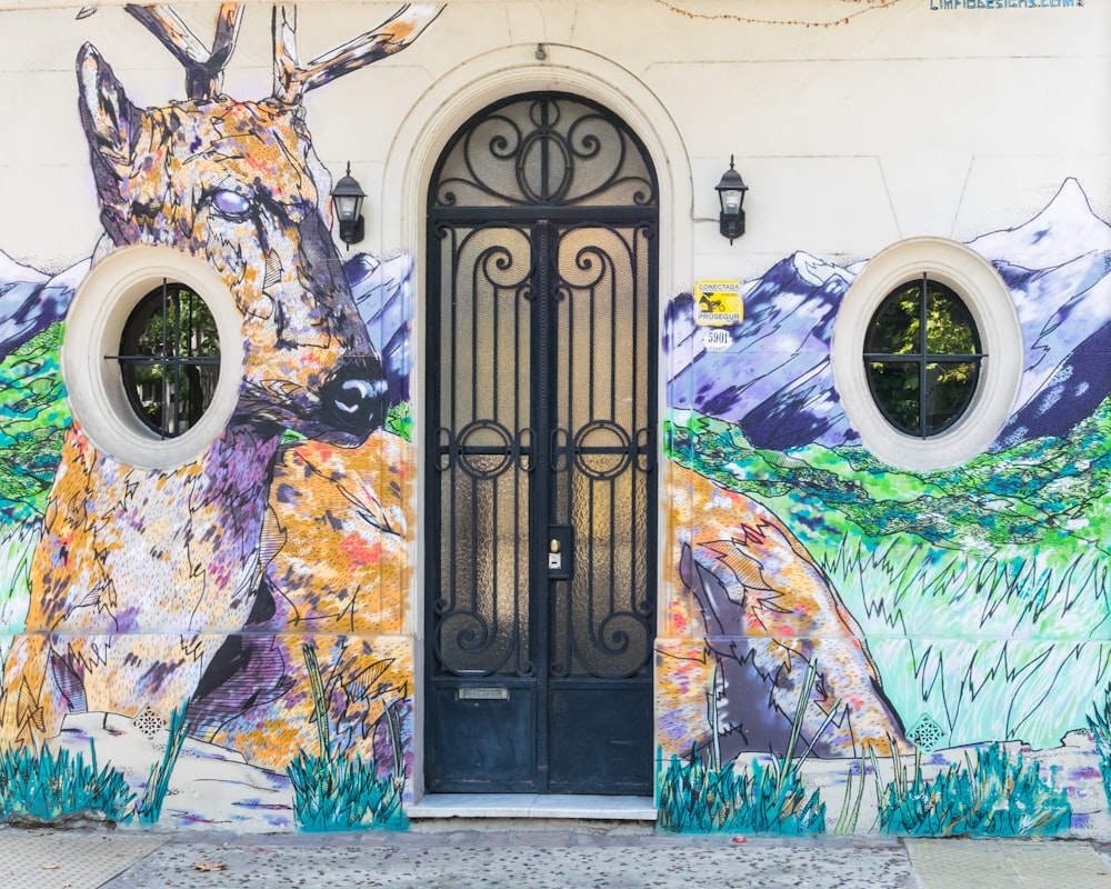 black metal door with blue and yellow floral design