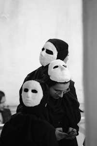 person wearing white and black panda costume