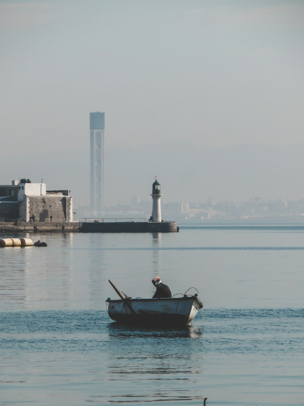 man in black shirt riding on boat during daytime