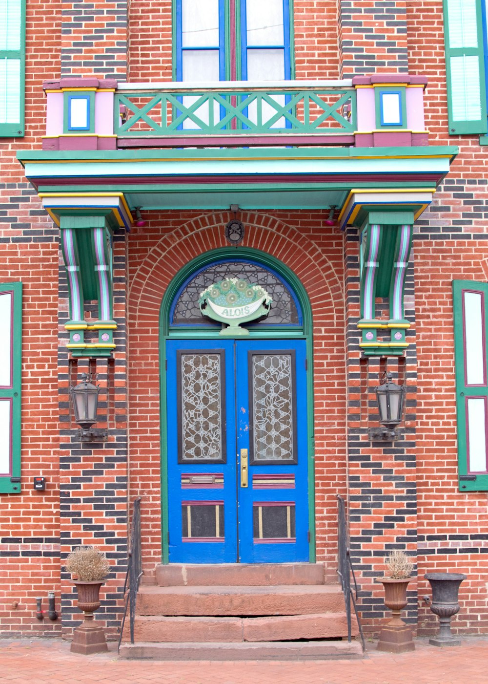 brown brick building with blue wooden door