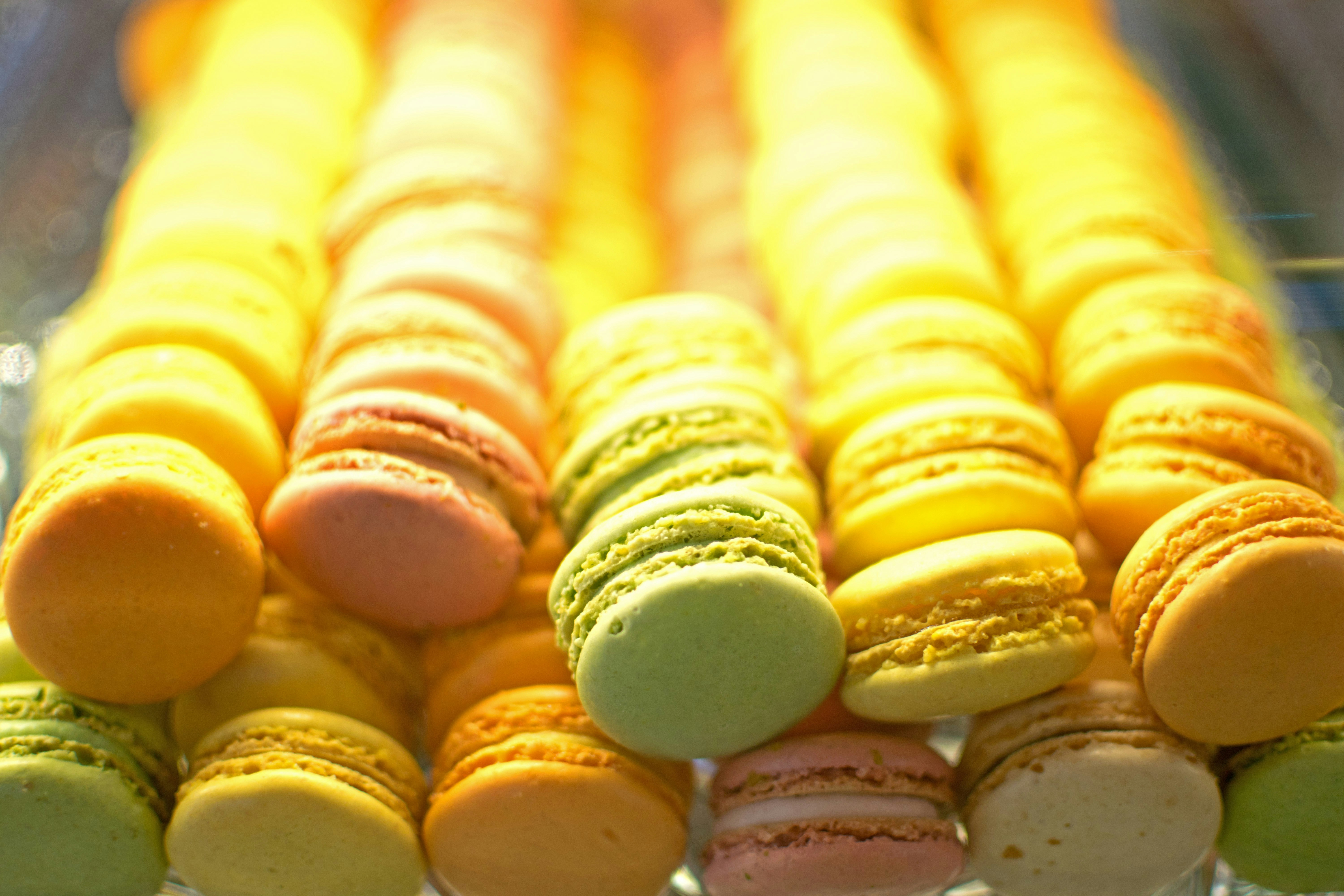 yellow and white french macaroons confectionery teams background