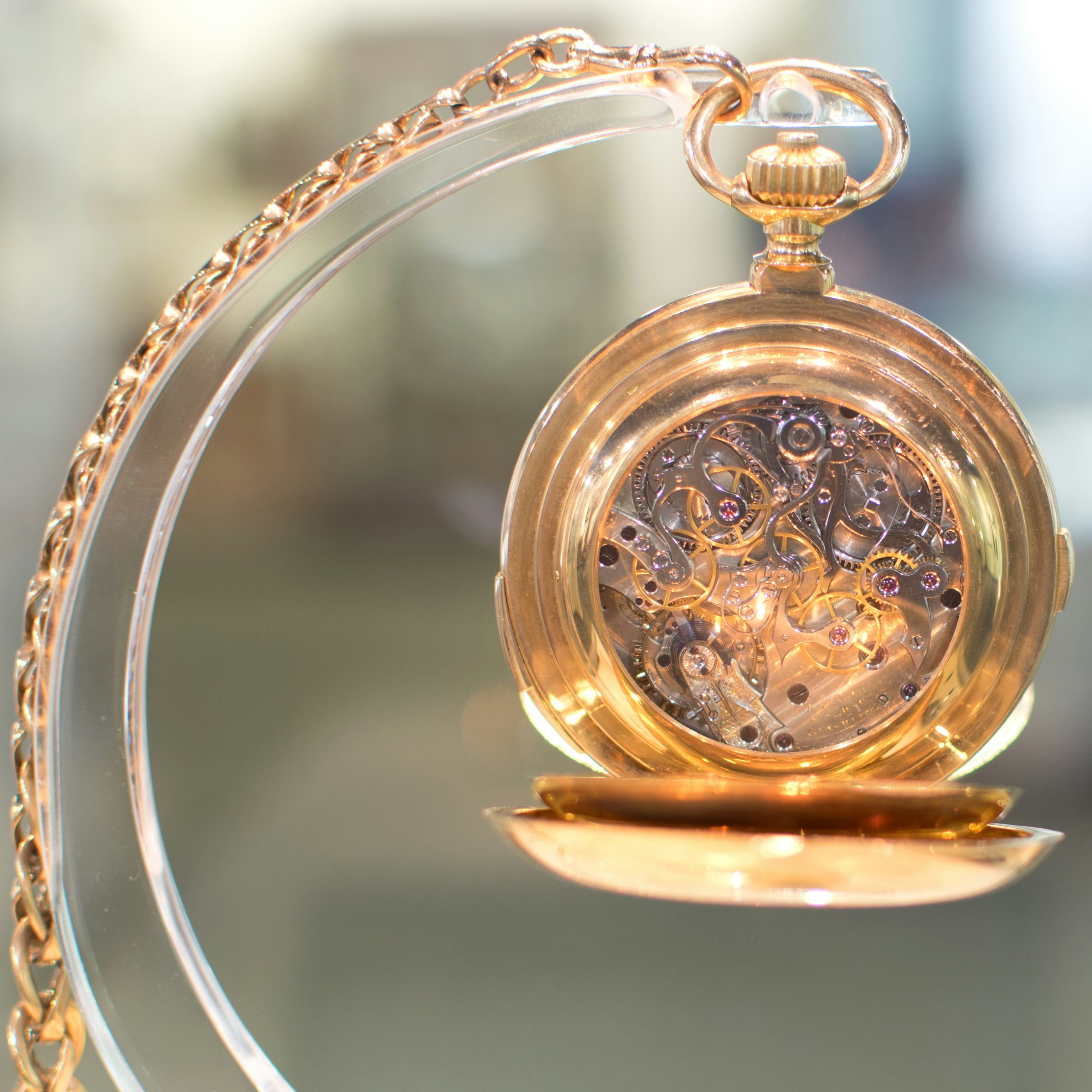 gold and silver round pendant