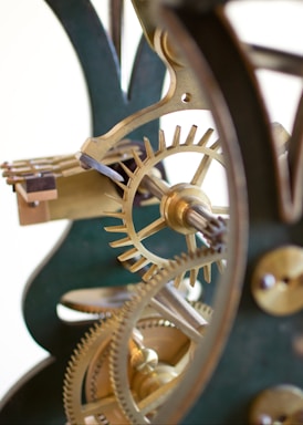 macro photography,how to photograph a beautiful shot of gears for a winding clock at the national watch and clock museum. ; black and gold steel gear