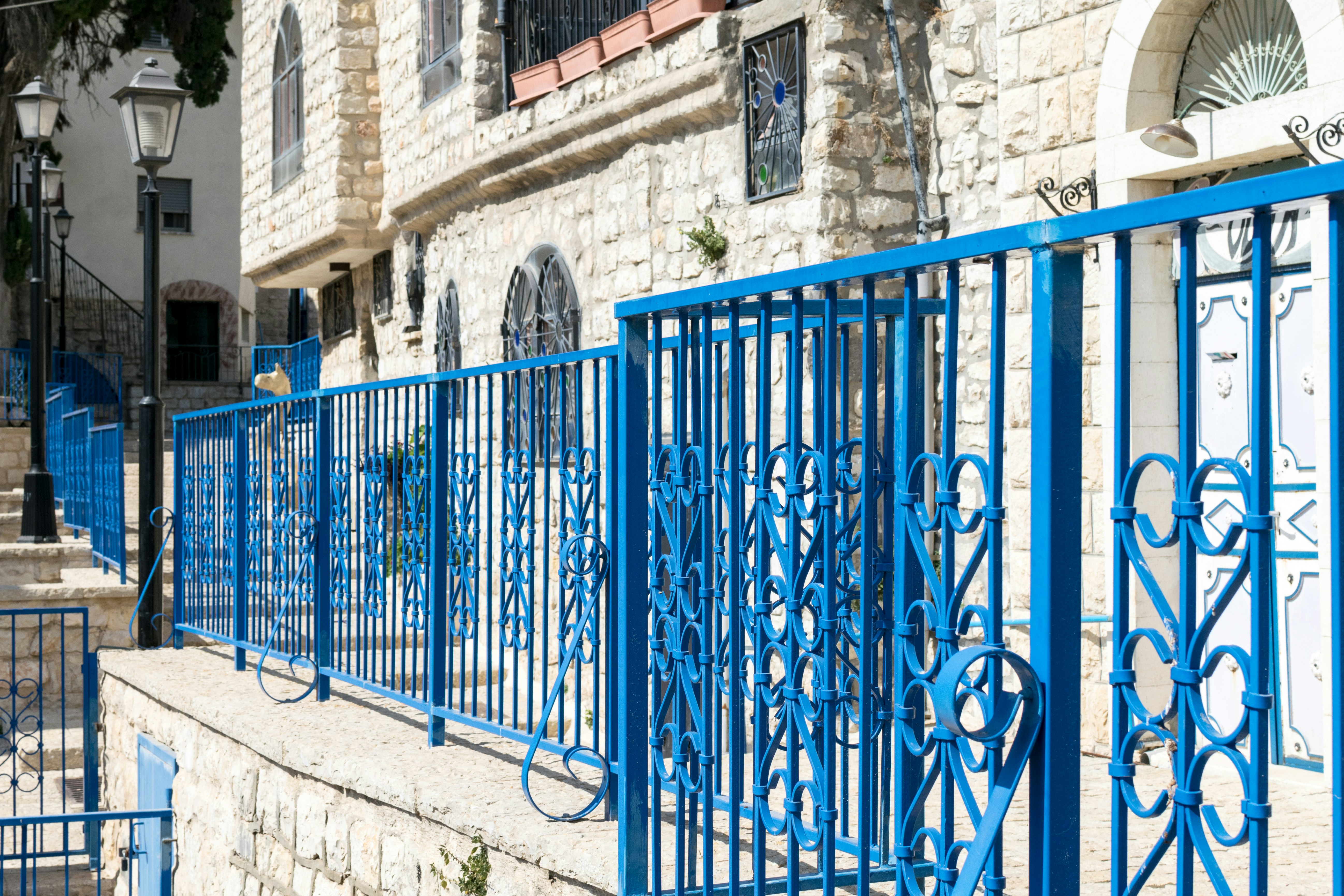 Blue metal fence near building