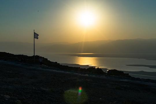 silhouette of people on beach during sunset in Masada Israel