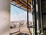 An aerial view of a completed metal structure in a city.