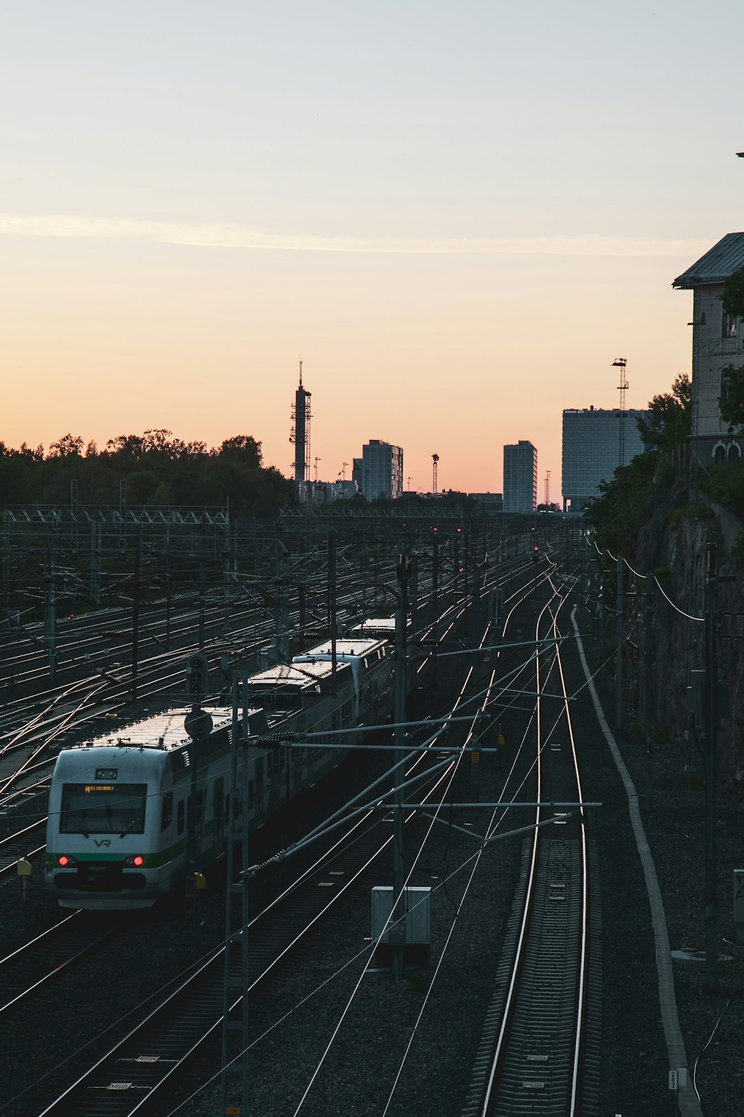 white train on rail road during daytime