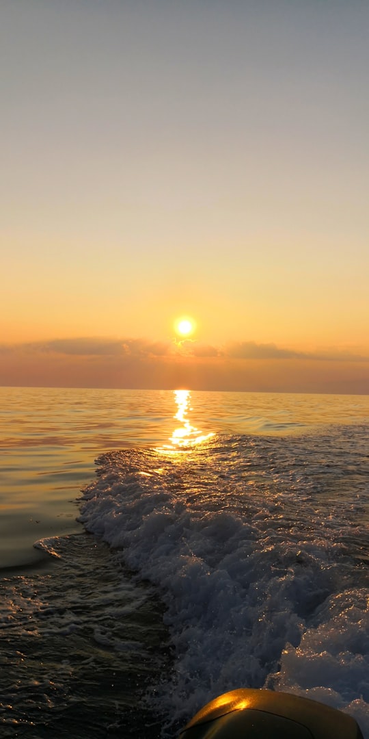 ocean waves crashing on rocks during sunset in Thasos Greece