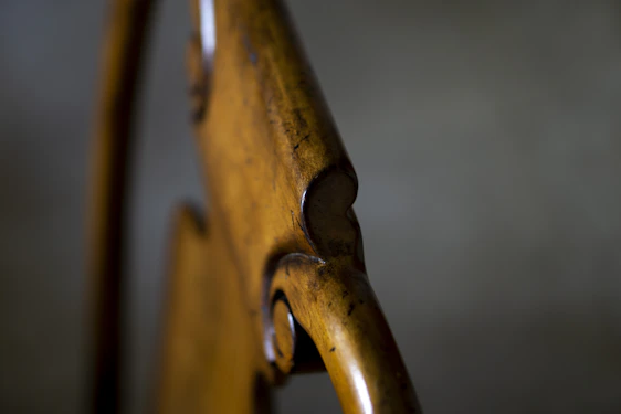 Close-up of a finely crafted wooden trophy with laser engraving, highlighting natural wood textures and elegant design.