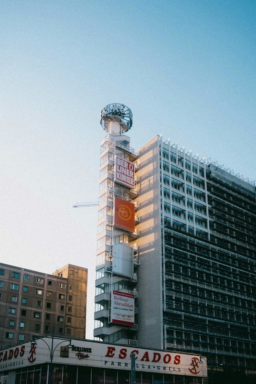 white and brown concrete building under blue sky during daytime