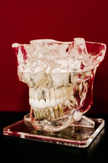 white round beads in clear glass bowl