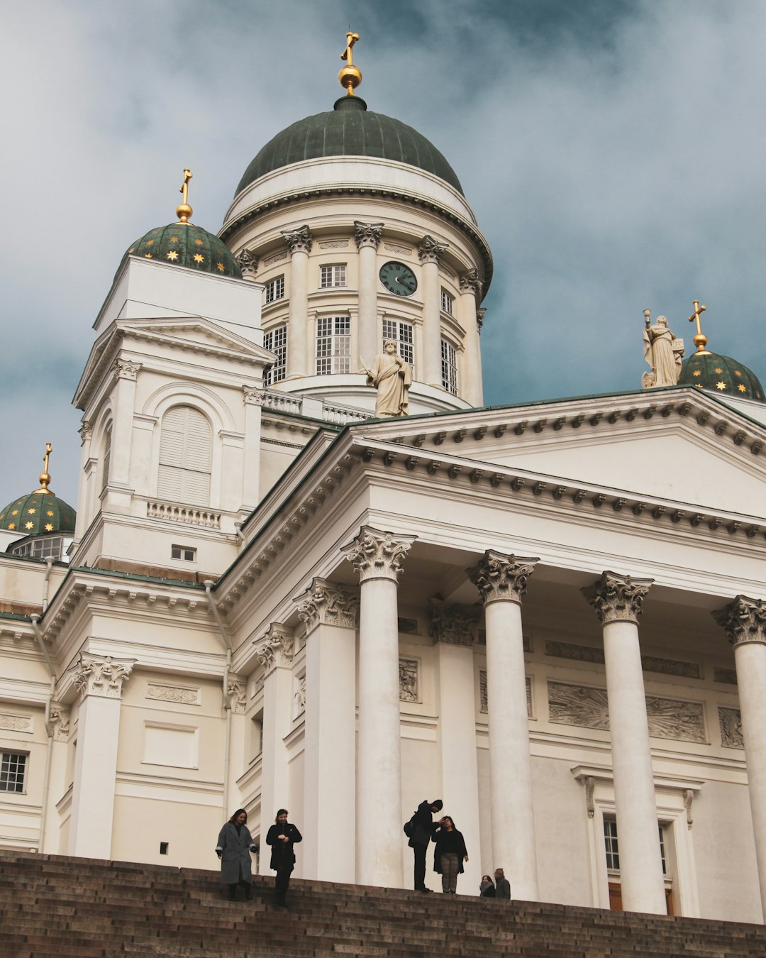 people walking near white concrete building during daytime