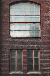 brown wooden framed glass window