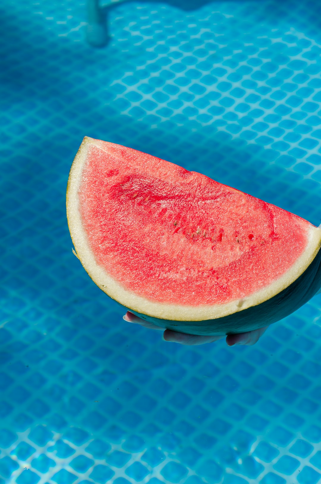 sliced watermelon on blue and white polka dot textile