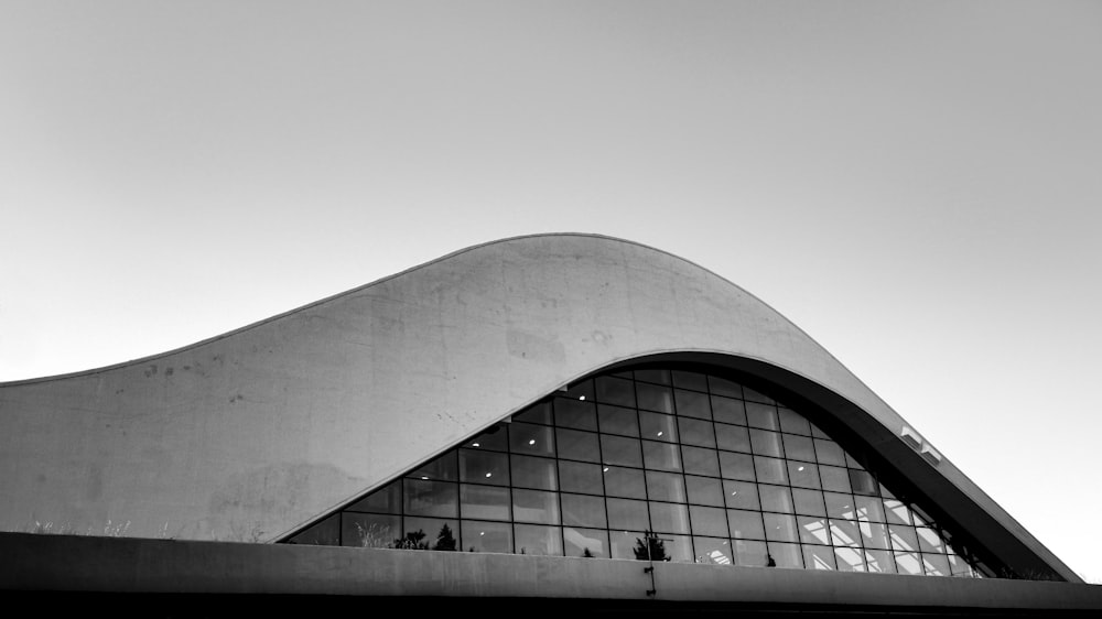 silhouette of people walking on building