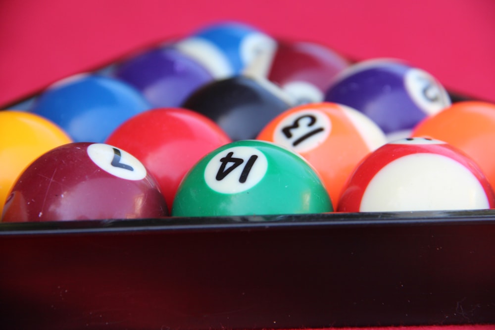 billiard balls on black table