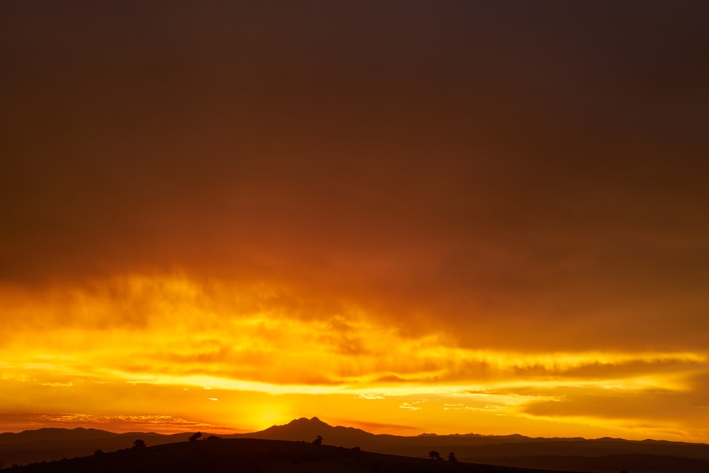 silhouette of mountain during sunset