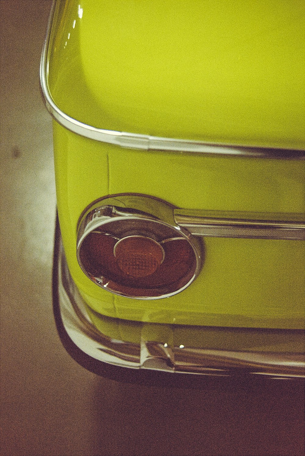 silver round coin on yellow luggage