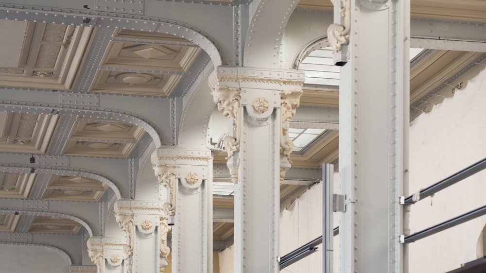 white concrete pillar inside building