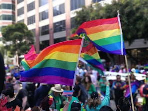 A vibrant street scene capturing LGBTQ+ pride celebrations.