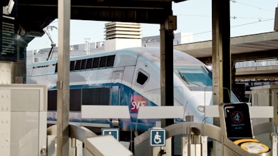 white and blue train during daytime