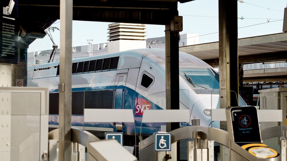 white and blue train during daytime