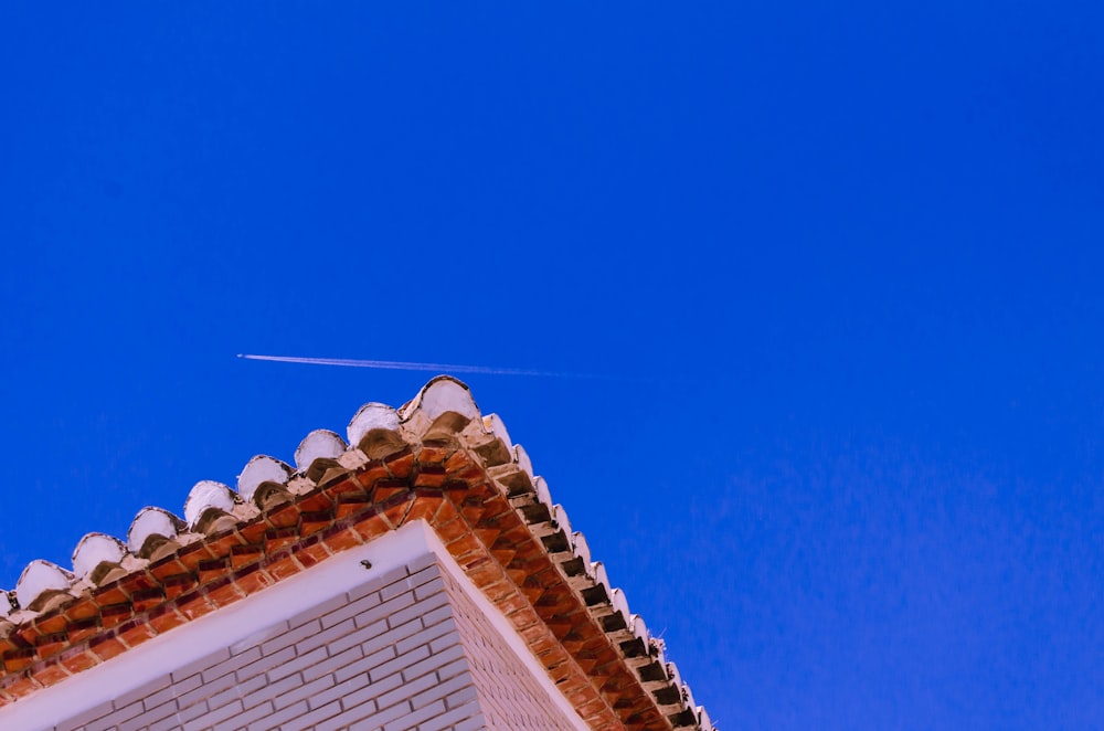 white and brown concrete house under blue sky during daytime