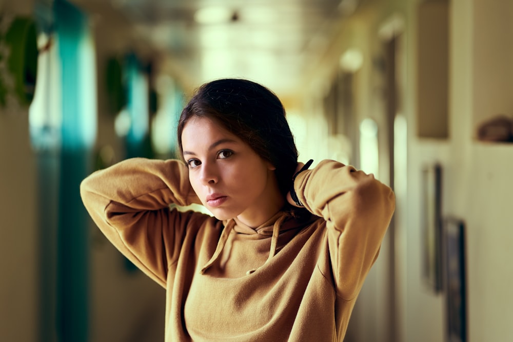 woman in brown turtleneck sweater