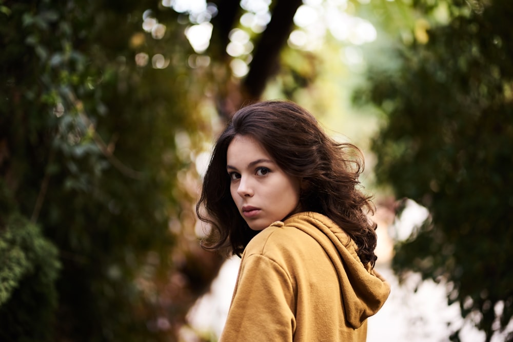 woman in brown turtleneck sweater