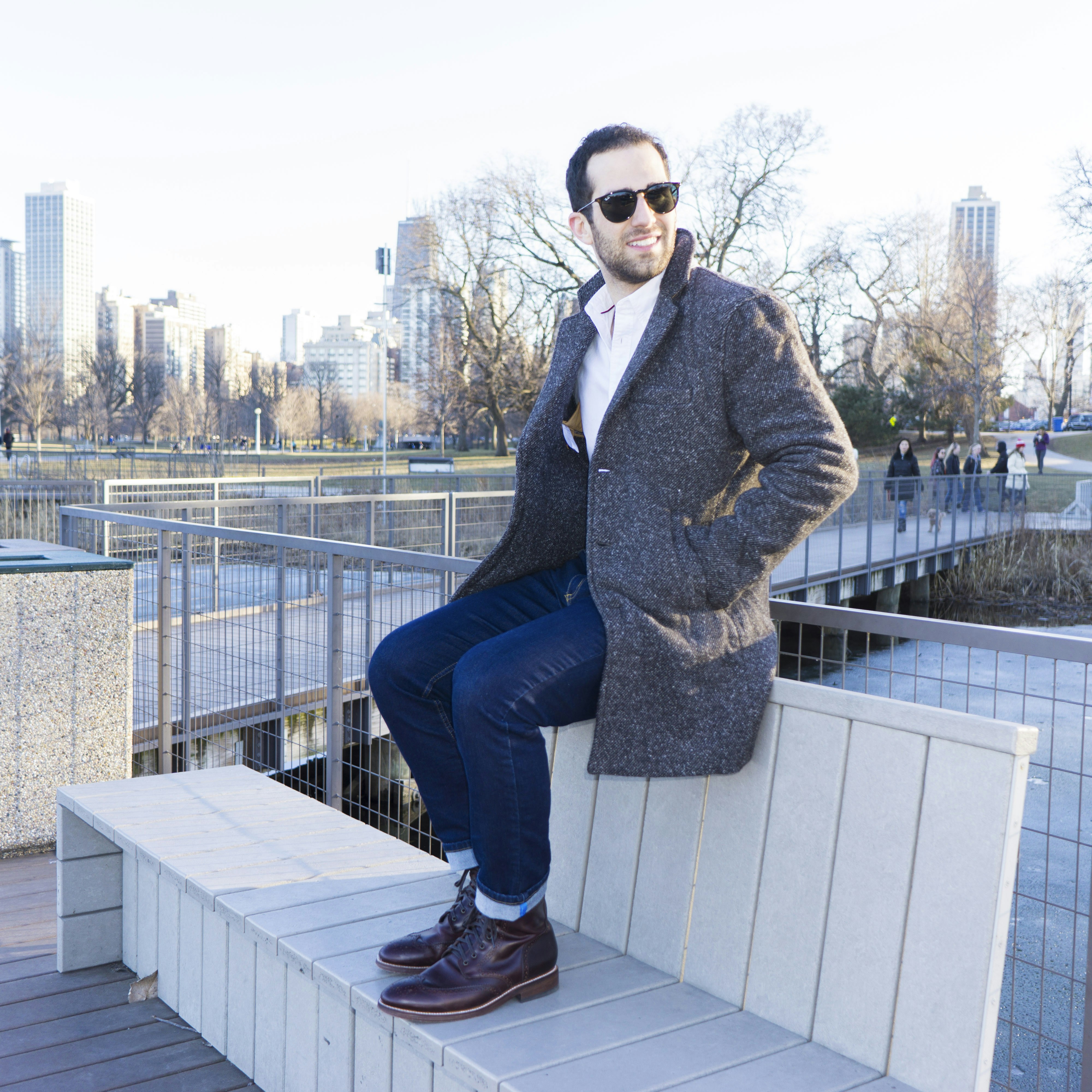 black coat and blue jeans