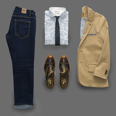 blue denim jeans and brown leather shoes