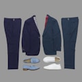 A collection of formal clothing items displayed on a flat surface, including two pairs of trousers and two suit jackets in different shades of blue, accompanied by a pair of white sneakers and a pair of light blue tassel loafers.