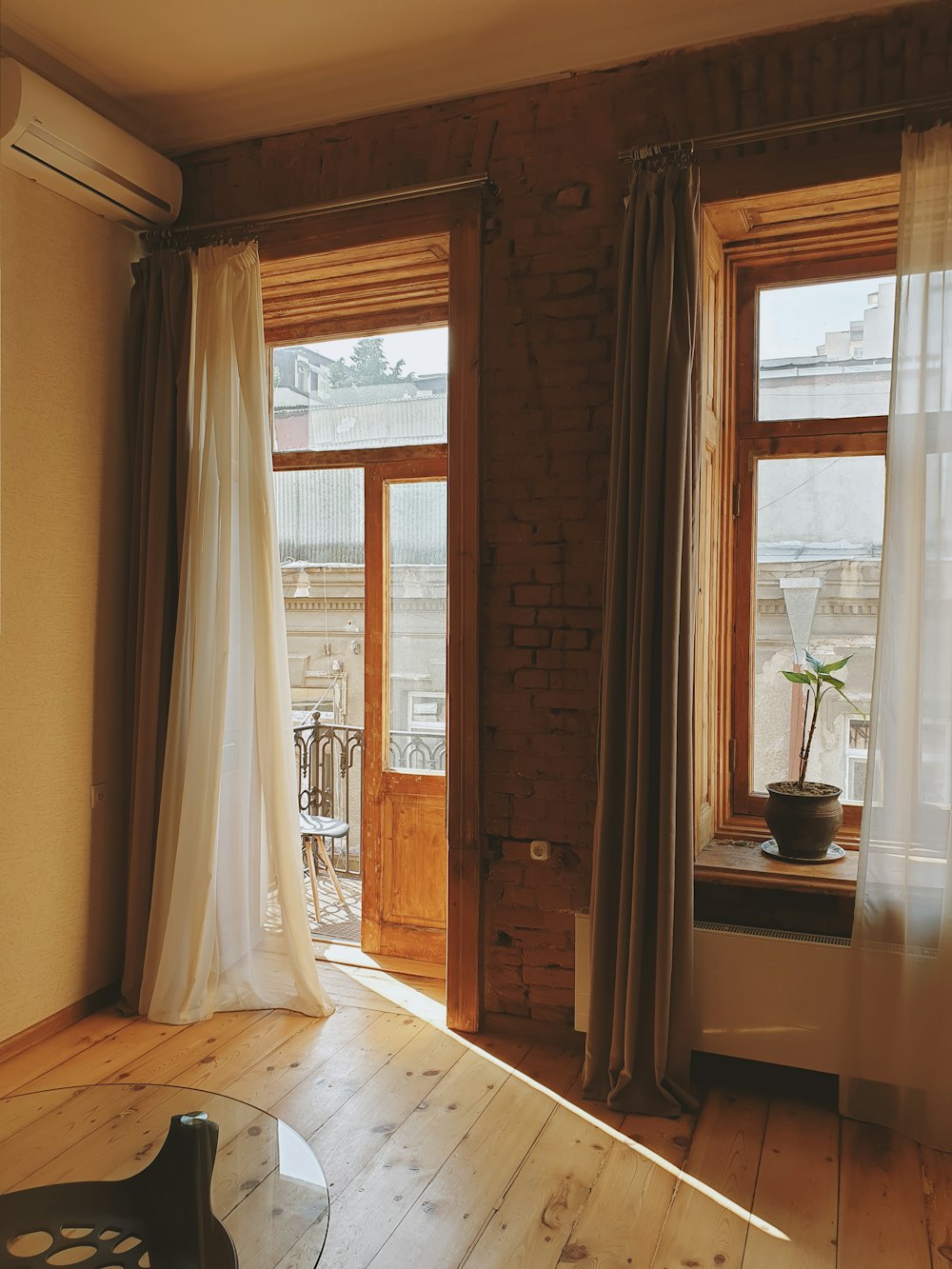 white window curtain near brown wooden door