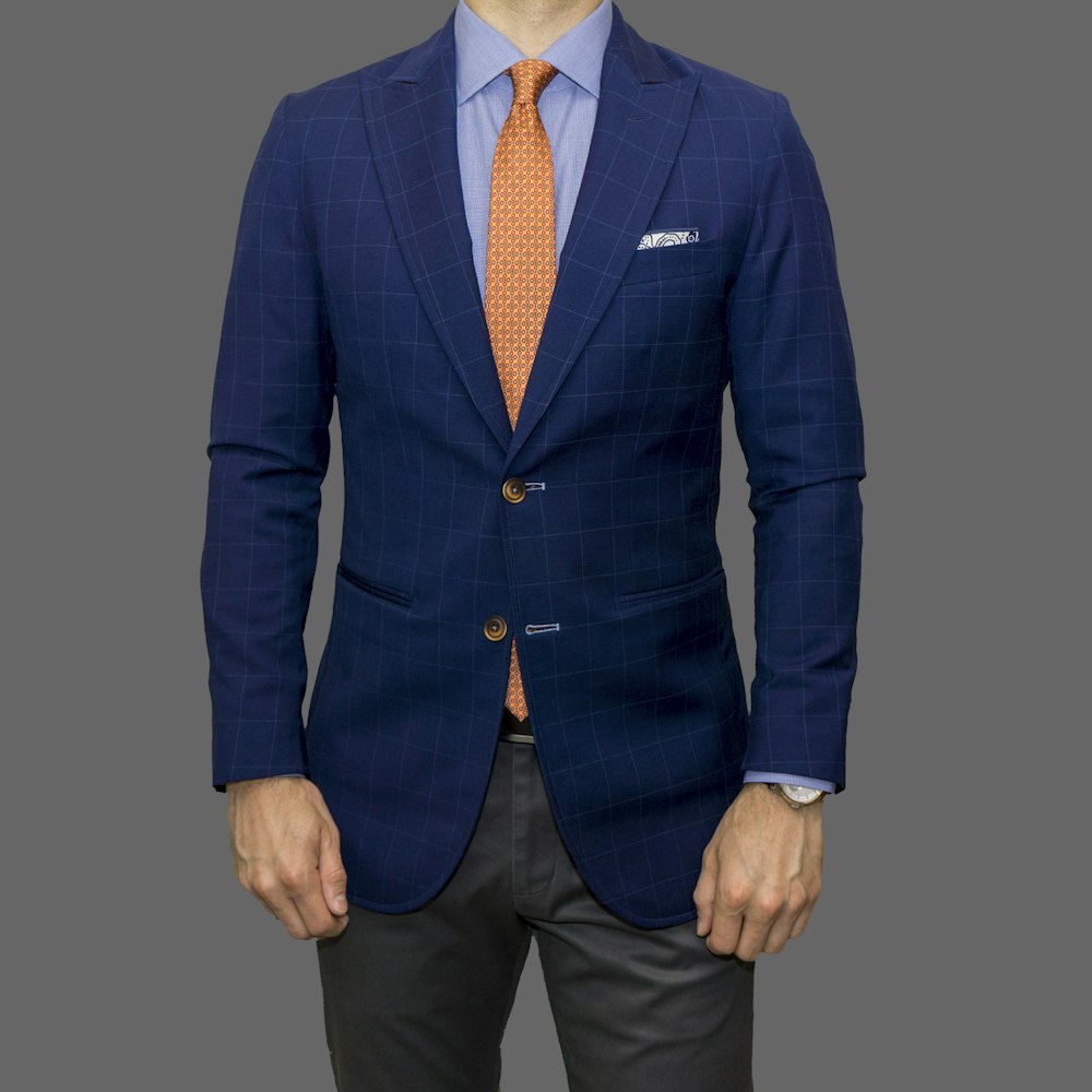 man in blue suit standing