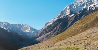 green and brown mountains under blue sky during daytime