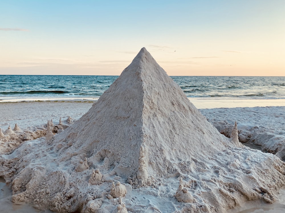 gray rock formation on seashore during daytime