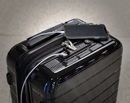 black and gray luggage bag