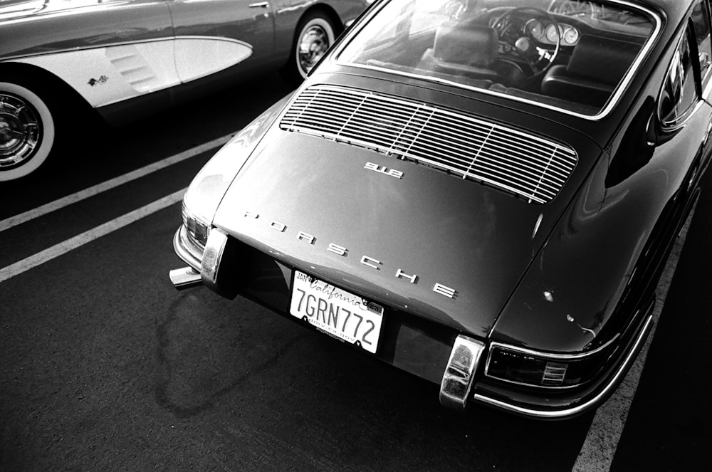 grayscale photo of car on road