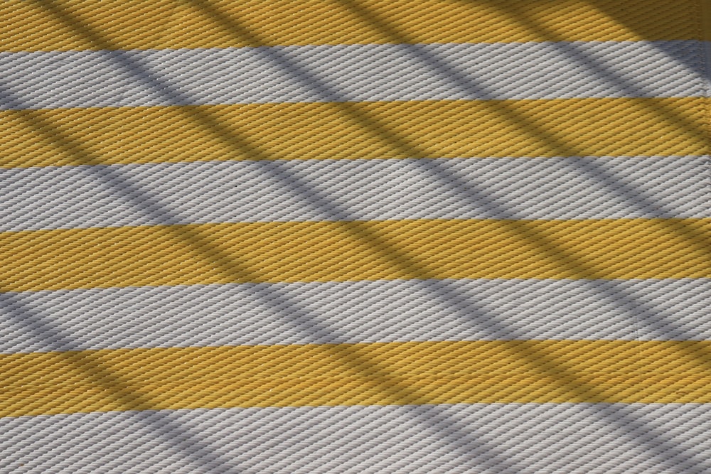 yellow and blue striped textile
