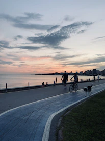 The Geyer family walking along a scenic Vancouver waterfront at sunset.